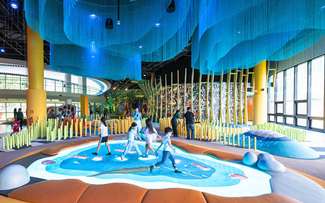 Image 4 - The striking Grasslands zone at Curiosity Cove features an immersive digital Watering Hole. Image credit to Mandai Wildlife Group 640